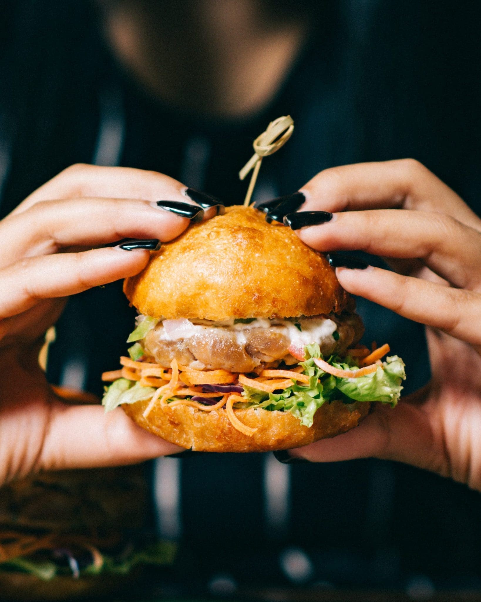 person holding burger